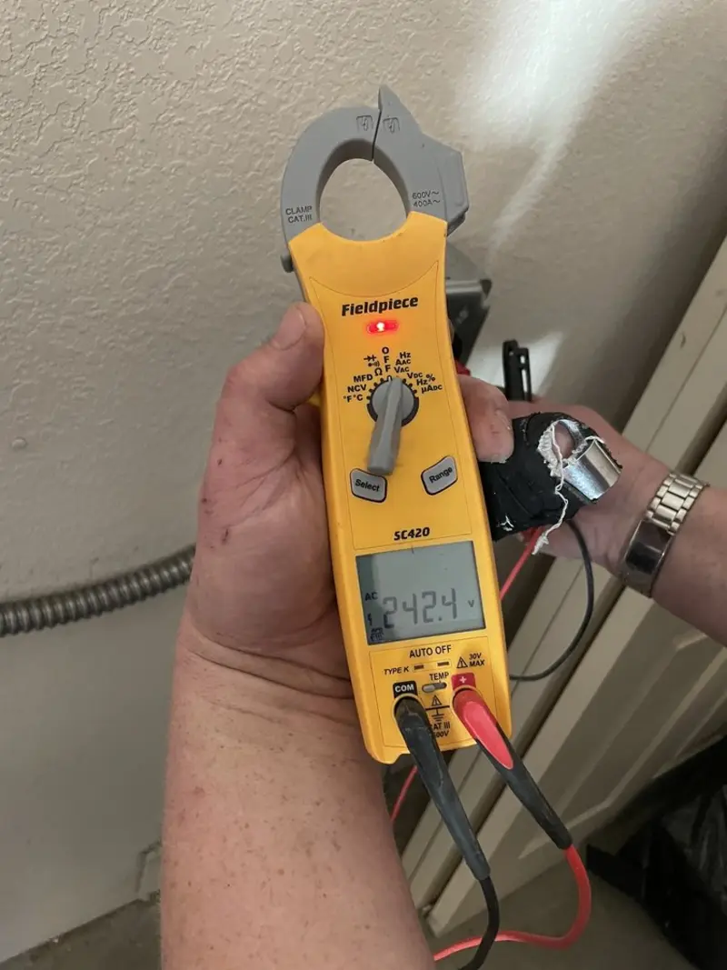 Voltage testing with clamp meter during Electrical Installation Services in Avon